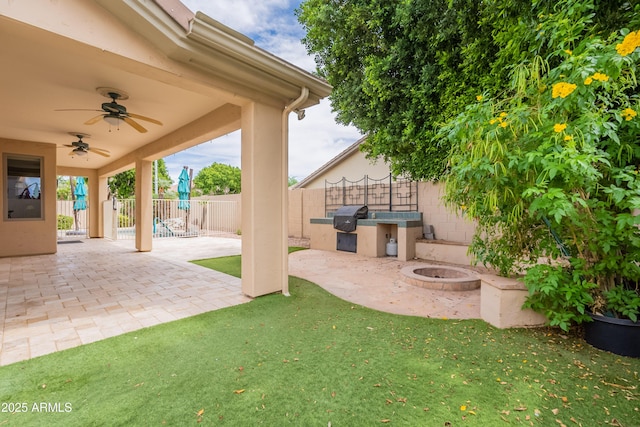 1555 E Monterey St, Chandler, AZ 85225 - view of patio / terrace featuring a ceiling fan, a fire pit, and area for grilling