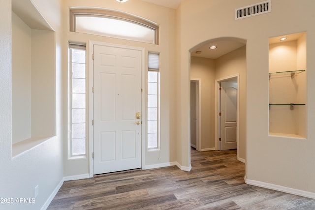 1555 E Monterey St, Chandler, AZ 85225 - foyer with arched walkways, wood finished floors, and baseboards