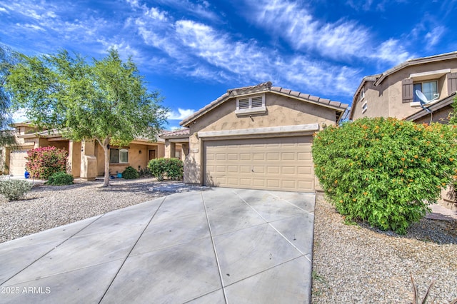 single story home featuring a garage, stucco siding, a tiled roof, and concrete driveway