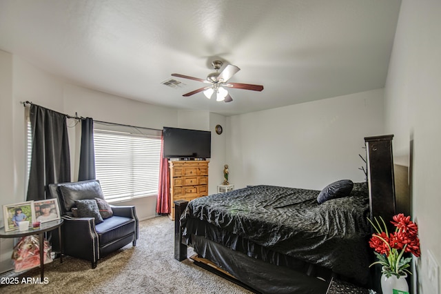 carpeted bedroom featuring a ceiling fan and visible vents