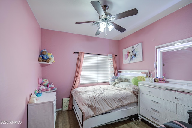bedroom featuring baseboards, a ceiling fan, and wood finished floors