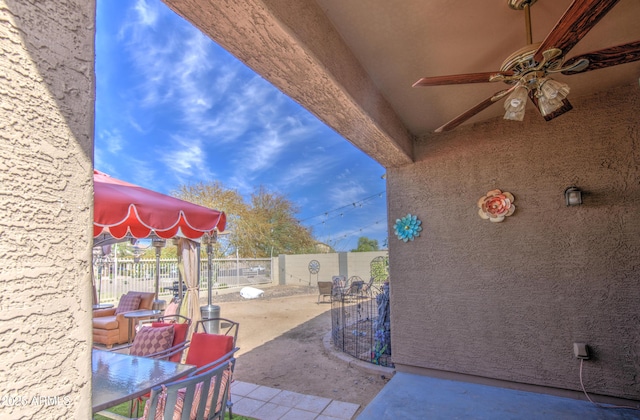 view of patio / terrace with a fenced backyard and ceiling fan