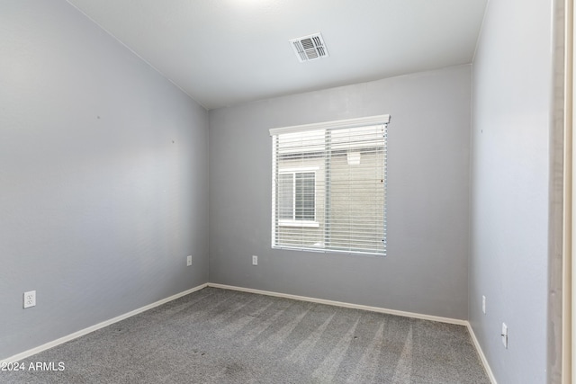 unfurnished room featuring carpet