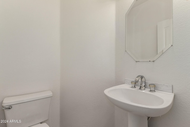 bathroom with sink and toilet