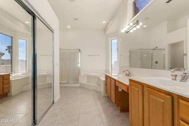 full bathroom with tile patterned flooring, a sink, and a shower stall