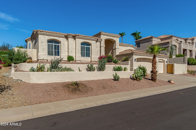 mediterranean / spanish-style house featuring a garage