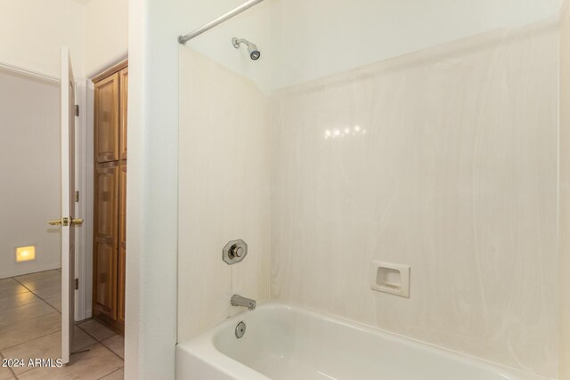 bathroom with tub / shower combination and tile patterned flooring