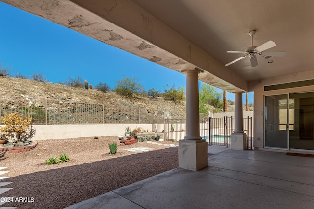 view of patio / terrace with a fenced backyard and ceiling fan