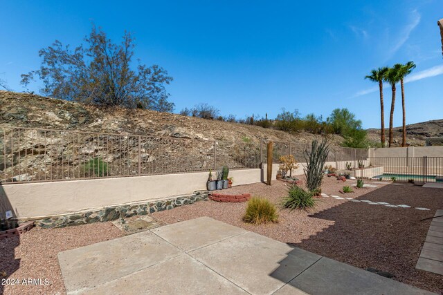 view of yard featuring a patio and a fenced backyard