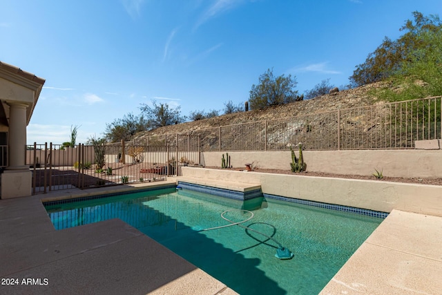 view of swimming pool with fence and a fenced in pool