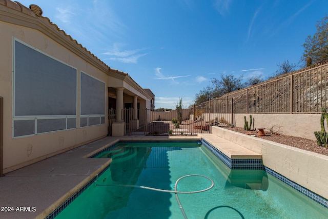 view of pool with a patio area, a fenced backyard, and a fenced in pool