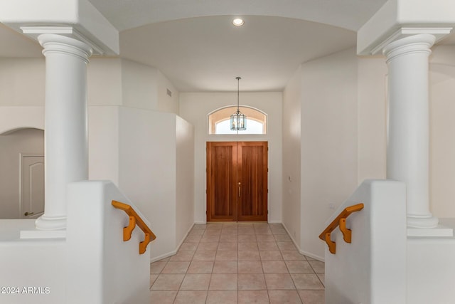 entryway with recessed lighting, light tile patterned flooring, decorative columns, and visible vents