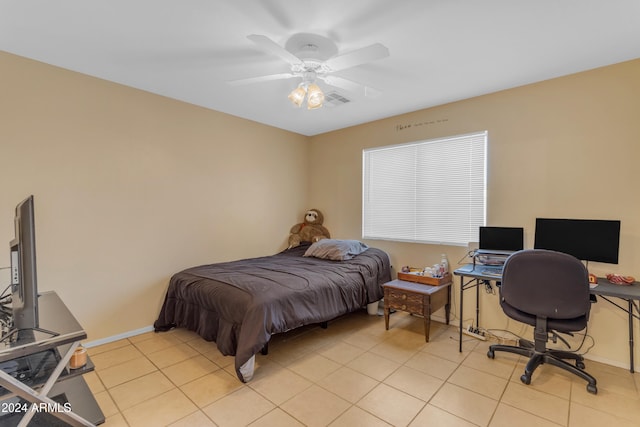 tiled bedroom with ceiling fan