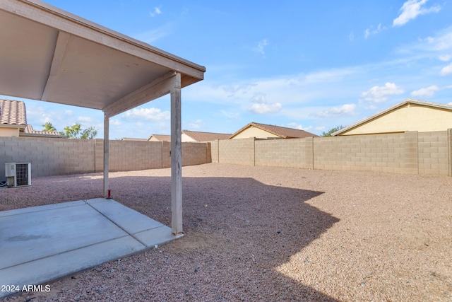 view of yard with a patio area and central AC unit