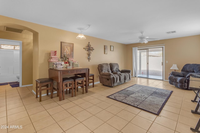 living room featuring ceiling fan and light tile patterned flooring