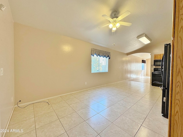 empty room featuring ceiling fan and light tile patterned flooring