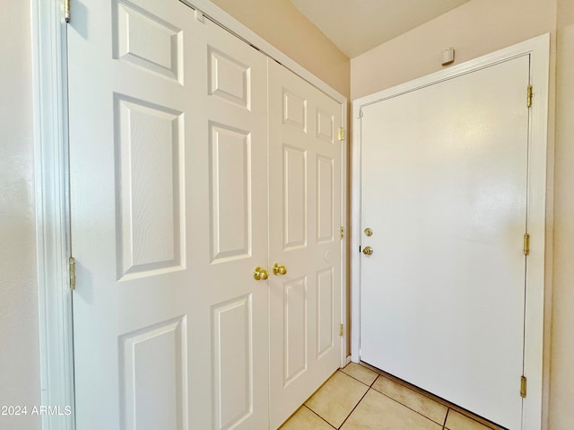 doorway featuring light tile patterned floors