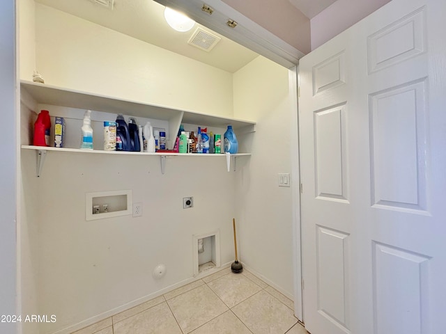 laundry room featuring washer hookup, light tile patterned floors, hookup for a gas dryer, and electric dryer hookup