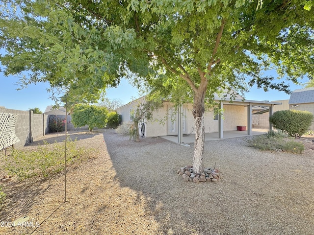 view of side of property with a patio