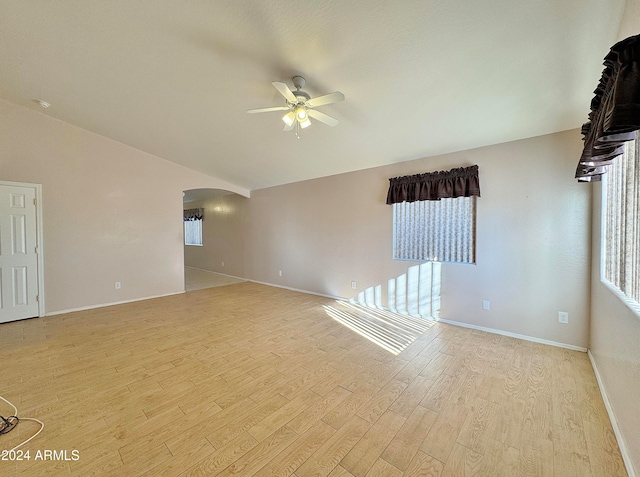 spare room featuring light hardwood / wood-style flooring and ceiling fan