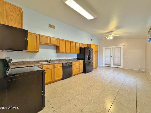 kitchen with ceiling fan, sink, black appliances, lofted ceiling, and light tile patterned flooring