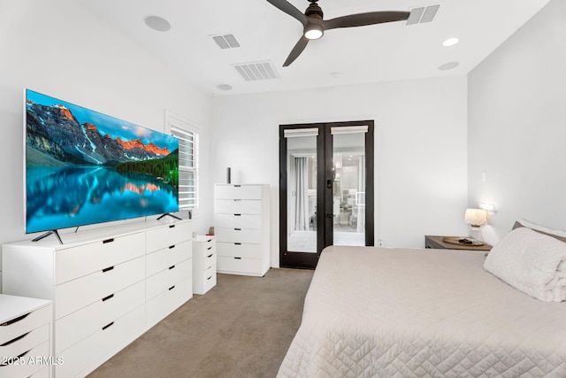 bedroom featuring french doors, light carpet, and visible vents