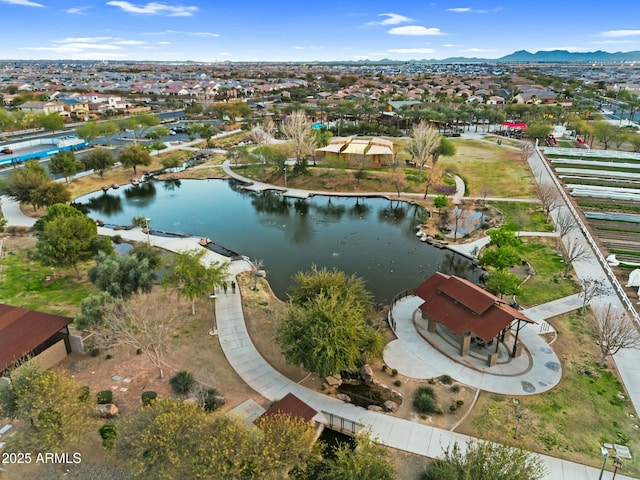 drone / aerial view with a water and mountain view