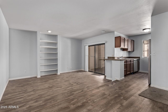 747 S Extension Rd Unit 113, Mesa, AZ 85210 - kitchen with dark countertops, dark wood-style floors, baseboards, stainless steel dishwasher, and built in features