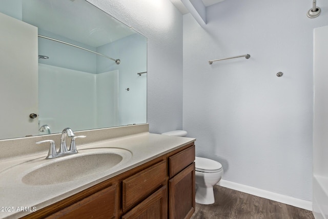 747 S Extension Rd Unit 113, Mesa, AZ 85210 - bathroom with toilet, vanity, wood finished floors, a shower, and baseboards