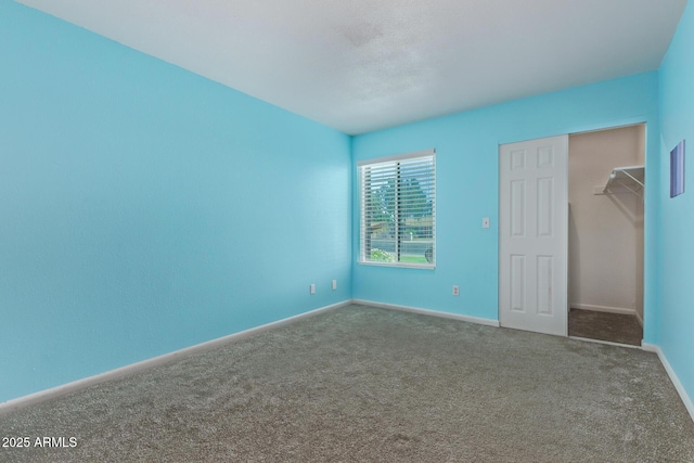 747 S Extension Rd Unit 113, Mesa, AZ 85210 - unfurnished bedroom featuring carpet floors and baseboards