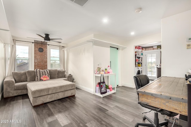 home office featuring visible vents, baseboards, ceiling fan, and wood finished floors