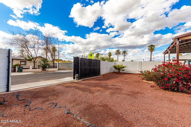 view of yard featuring a gate and fence