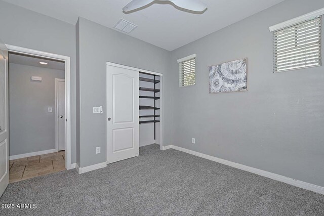 6611 S San Jacinto St, Gilbert, AZ 85298 - unfurnished bedroom with carpet, baseboards, a closet, and a ceiling fan