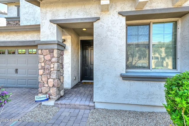 6611 S San Jacinto St, Gilbert, AZ 85298 - doorway to property with stucco siding and stone siding