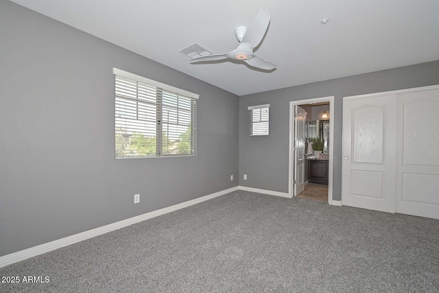 6611 S San Jacinto St, Gilbert, AZ 85298 - unfurnished bedroom featuring carpet flooring, baseboards, connected bathroom, a ceiling fan, and a closet
