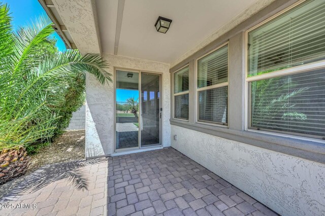 6611 S San Jacinto St, Gilbert, AZ 85298 - view of exterior entry featuring stucco siding and a patio area