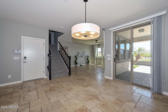 6611 S San Jacinto St, Gilbert, AZ 85298 - entrance foyer featuring stone tile flooring, baseboards, stairs, and a ceiling fan