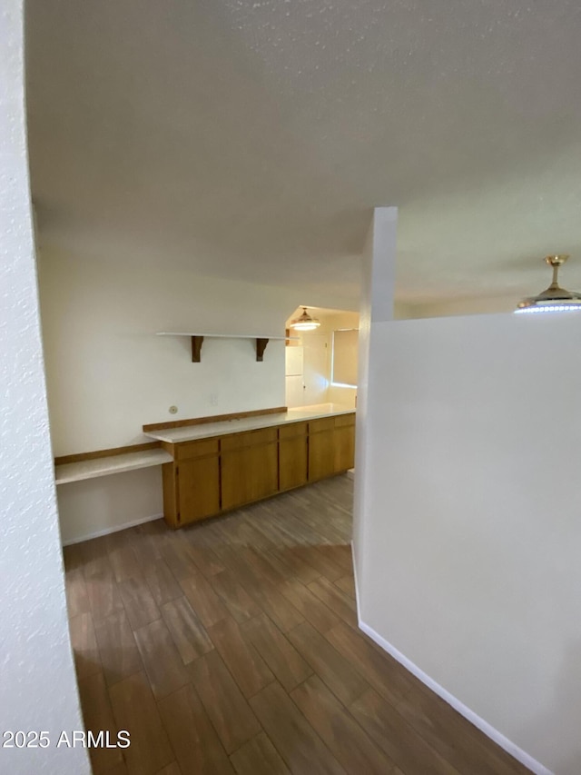 2569 W Berridge Ln Unit D-115, Phoenix, AZ 85017 - interior space with dark wood-type flooring and baseboards