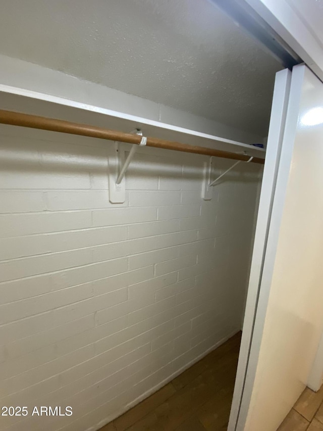 2569 W Berridge Ln Unit D-115, Phoenix, AZ 85017 - walk in closet with wood finished floors