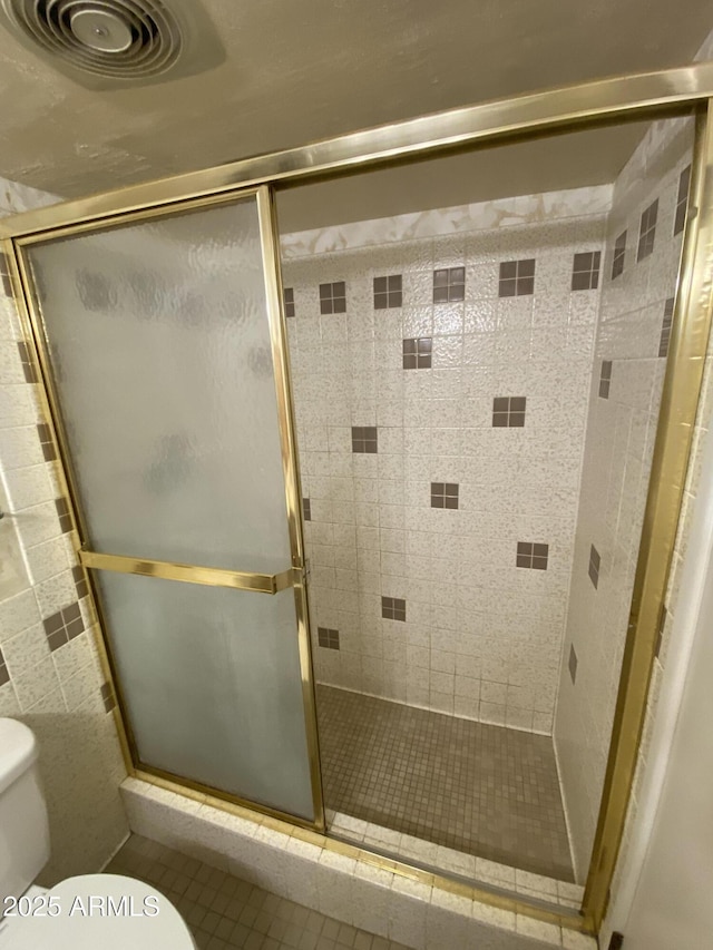 2569 W Berridge Ln Unit D-115, Phoenix, AZ 85017 - bathroom featuring toilet and a stall shower