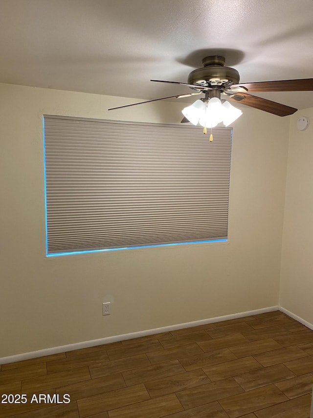 2569 W Berridge Ln Unit D-115, Phoenix, AZ 85017 - unfurnished room with baseboards, wood finished floors, and ceiling fan