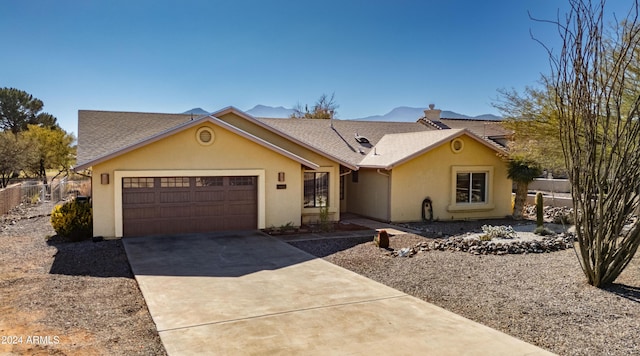 ranch-style home with a garage