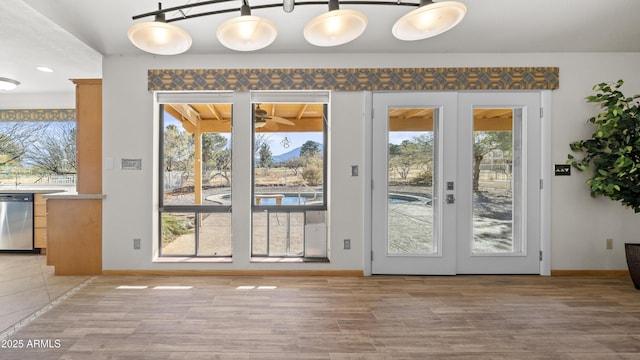 entryway with hardwood / wood-style flooring and french doors