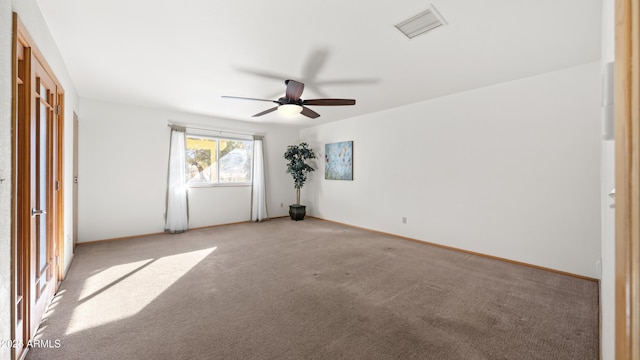 unfurnished room with light carpet and ceiling fan