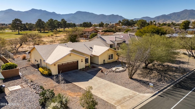 birds eye view of property with a mountain view