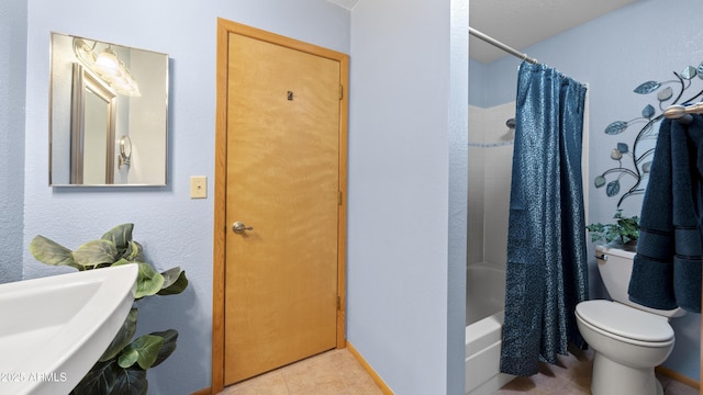 bathroom featuring tile patterned flooring, toilet, and shower / bathtub combination with curtain