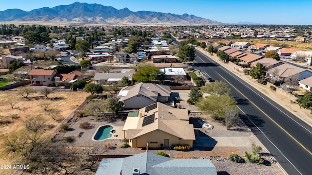 birds eye view of property featuring a mountain view