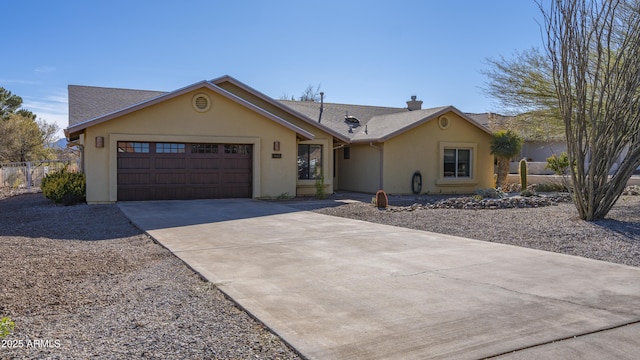 ranch-style home featuring a garage