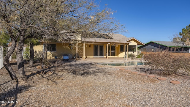 rear view of house with a patio