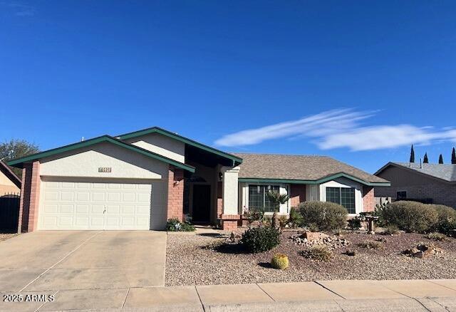 ranch-style home featuring a garage